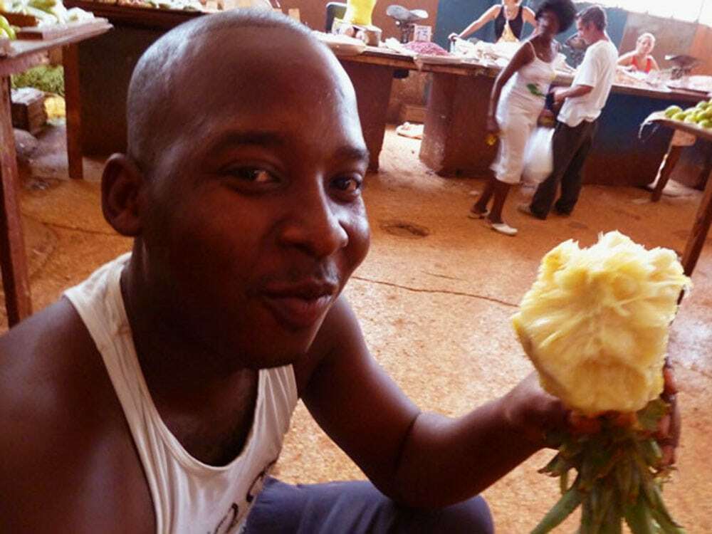 Cuba Market, boy with pineapple - Food Gypsy