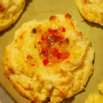 Top with red pepper jelly and bake.
