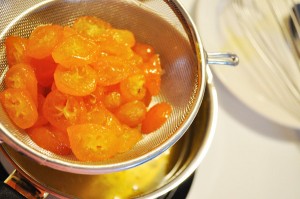Straining candied kumquats - Food Gypsy